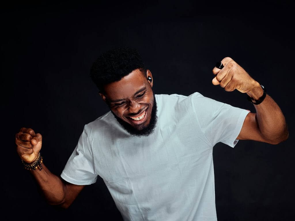 Happy man celebrating with a big smile