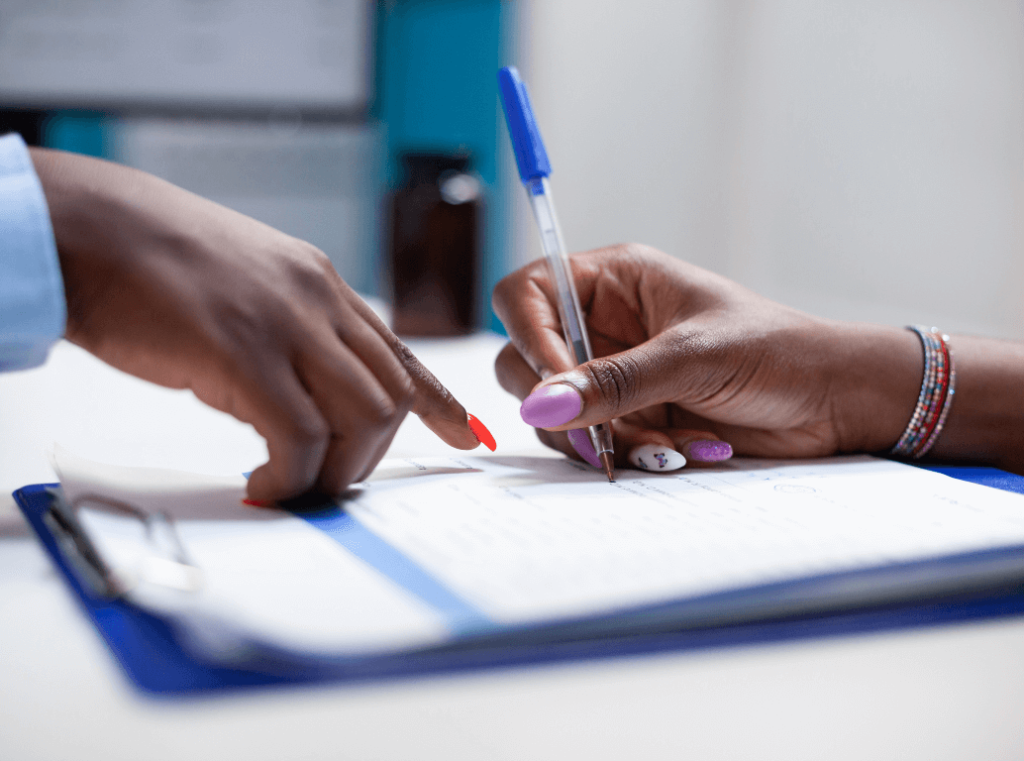 Job applicant signing a consent form for a POPIA-compliant background screening.