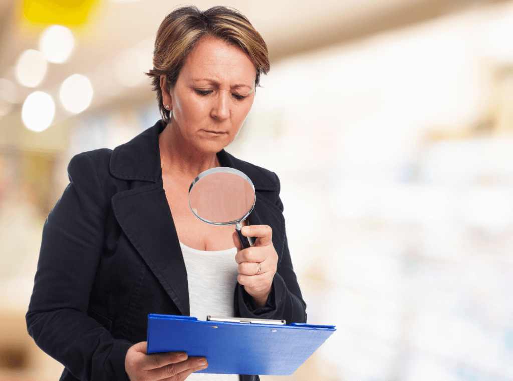 A recruiter closely reviewing employee documents for POPIA-compliant hiring checks.