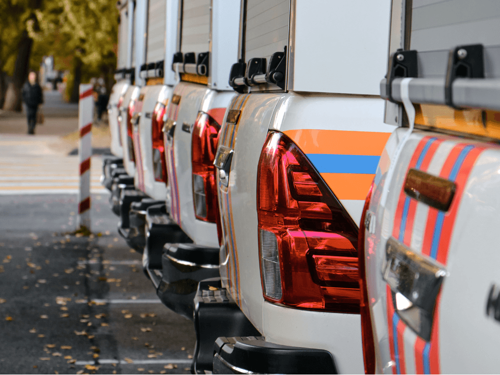 Company fleet in a parking lot, highlighting the importance of licence verification before operating a company car.